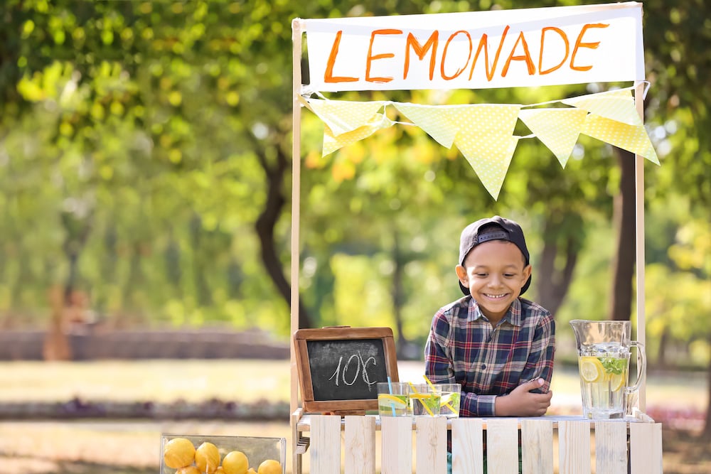 Boy selling lemonade