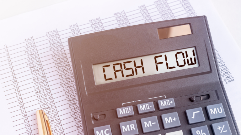 Cash flow statement example paper with a calculator on top.