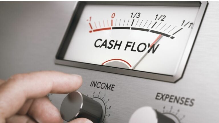 Operating cash flow gauge with a hand turning the income dial.