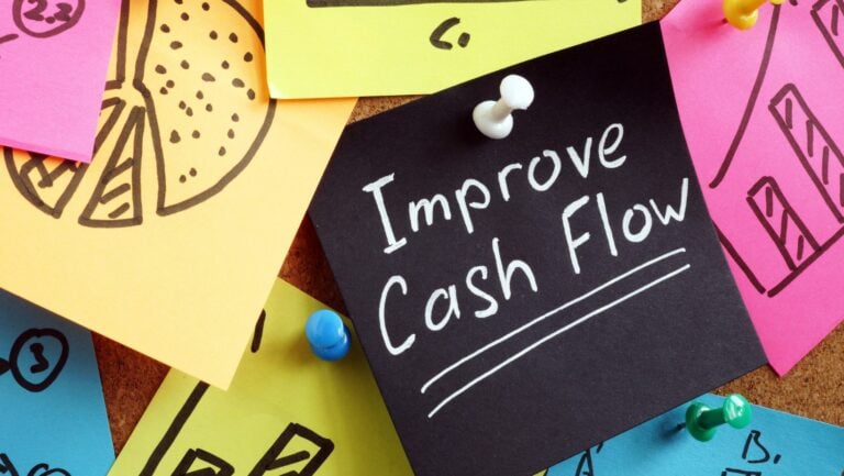 What is operating cash flow: "improve cash flow" in white font color written on a black sticky note.
