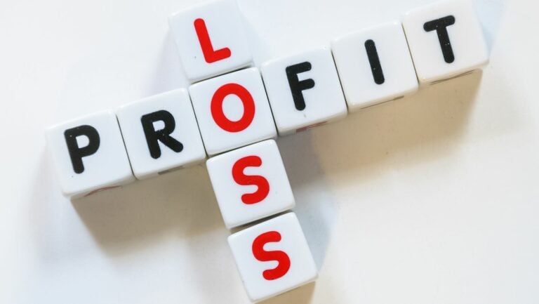Is cash flow the same as profit and loss: cubes in letters spelled profit in black and loss in red.