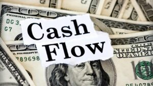 What is the main purpose of cash flow: a bunch of dollar bills labeled cash flow on top.