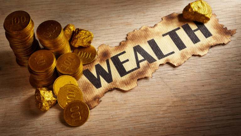 Why is generational wealth lost? An old paper labeled "wealth" with gold coins around it represents family wealth.