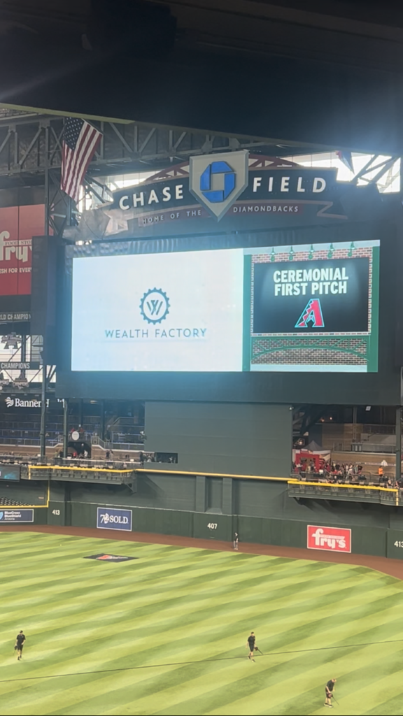 Wealth Factory logo prominently displayed on the scoreboard at the Arizona Diamondbacks game