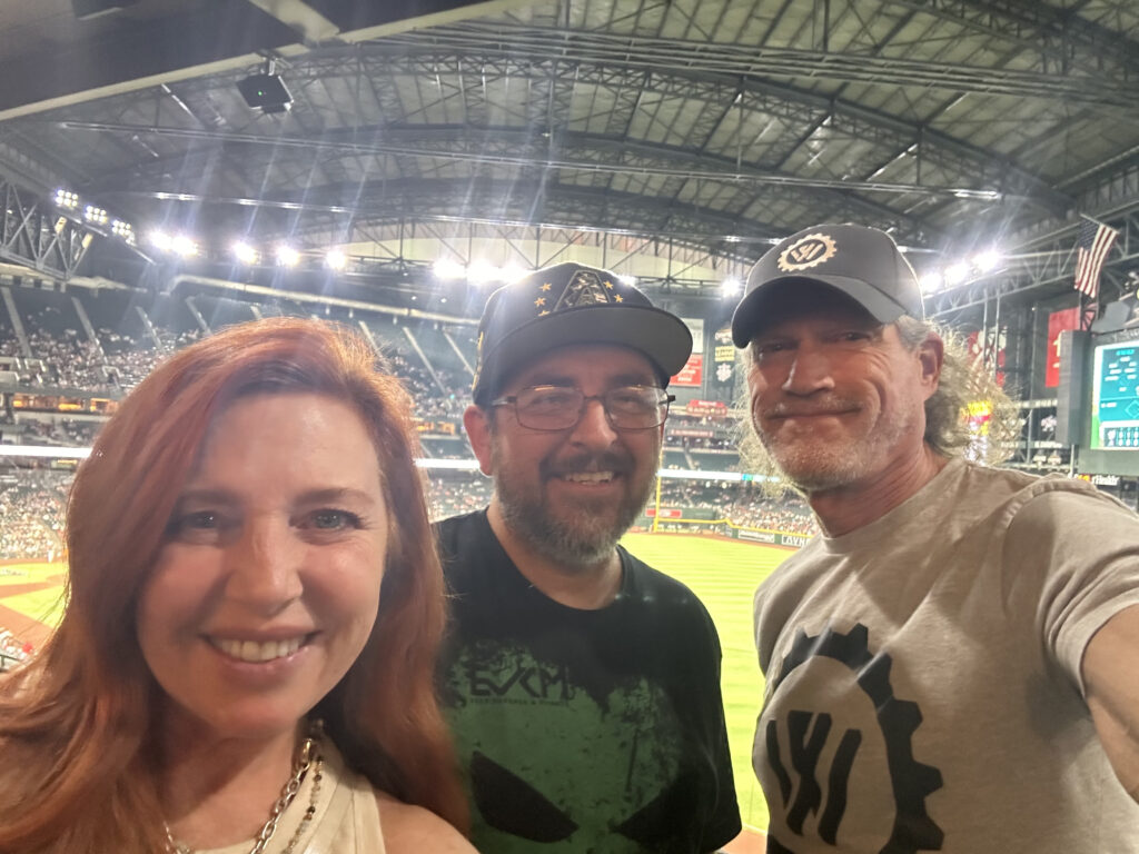 Wealth Factory team and clients posing for a photo at the Arizona Diamondbacks game