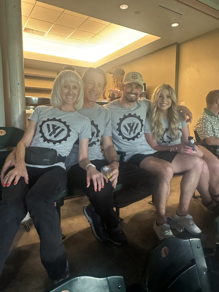 Group photo of the Wealth Factory team at the Arizona Diamondbacks game, celebrating their sponsorship